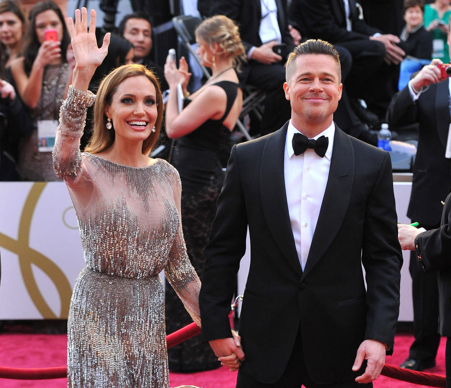 o, Angelina Jolie, left, and Brad Pitt arrive at the Oscars at the Dolby Theatre in Los Angeles. Jolie and Pitt were married Saturday, Aug. 23, 2014, in France, according to a spokesman for the couple. (Photo by Vince Bucci/Invision/AP, File)