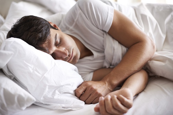 Shot of a young man sleeping in bed